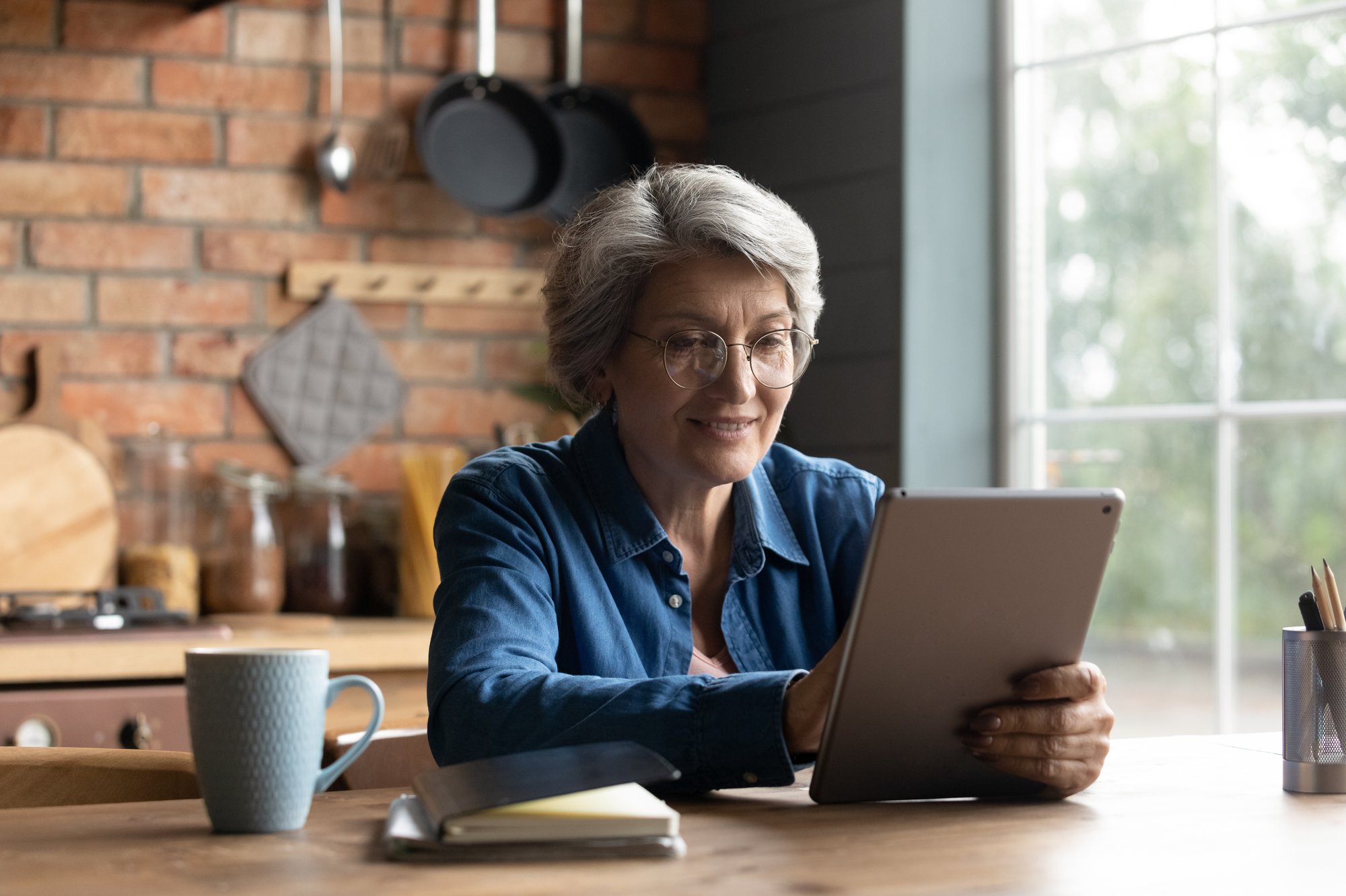 older woman customer using tablet